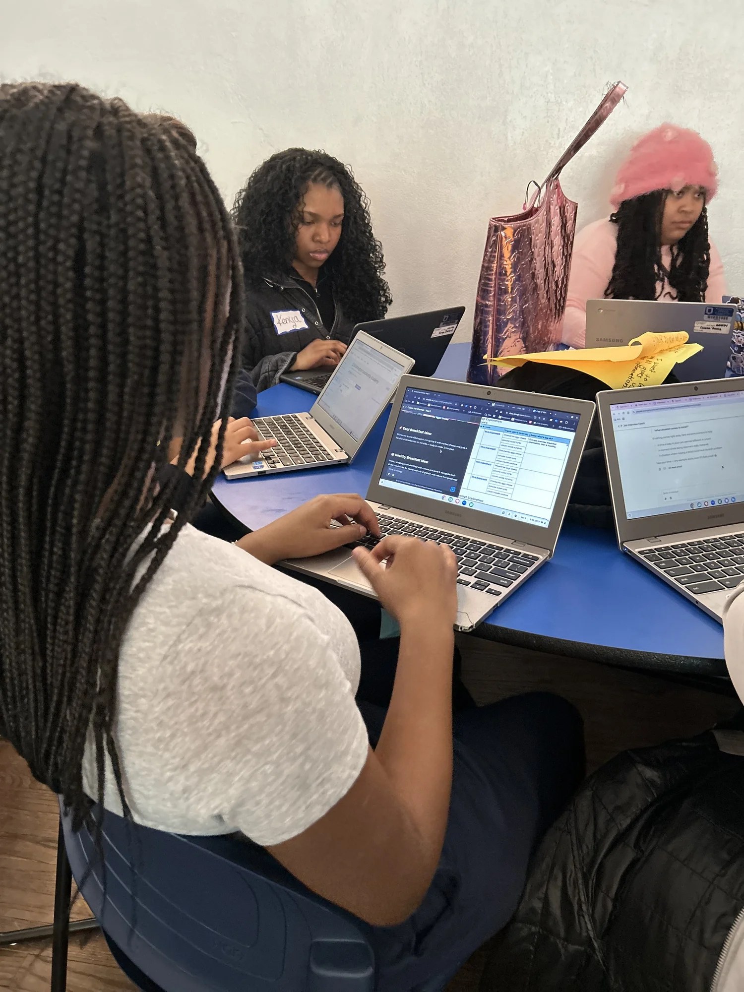 WLA students working together on laptops in class